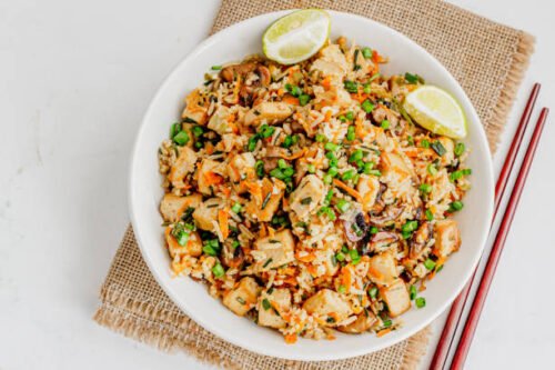 Asian High Protein Veg Fried Rice in a Bowl With Chopsticks Top Doan Photo